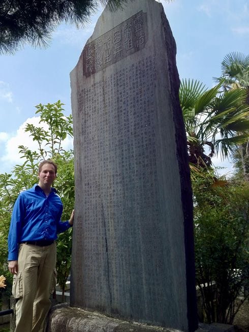 Memorial stone inscription for Mikao Usui with Dr. mark Hosak